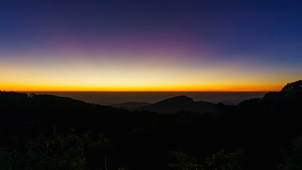 Beautiful green mountain landscape of colorful sunrise shining over Doi Inthanon at Mae Jam, Chiang Mai, Thailand.