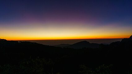 Beautiful green mountain landscape of colorful sunrise shining over Doi Inthanon at Mae Jam, Chiang Mai, Thailand.