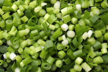 Cut fresh green onions as background, top view