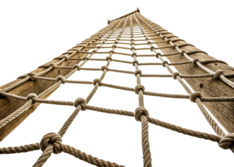 Close up of a nautical rope ladder made of thick rope and wooden poles, seen from a low angle looking up against a bright sky, suggesting adventure and exploration.