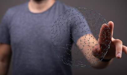 Close-up of a man's hand touching a network sphere, symbolizing global communication and connectivity, perfect for tech and future concepts.