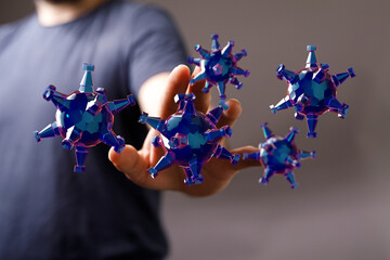 An artistic representation of a hand interacting with abstract virus particles. This image conveys concepts li