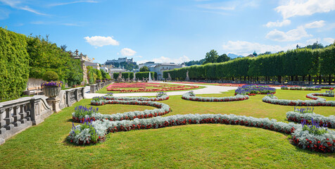 pictorial gardens of Mirabell, with ornamental flower beds and view to the fortress, Salzburg
