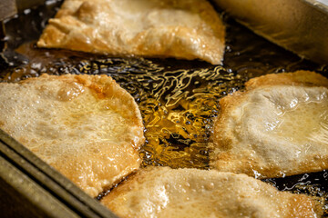 Halal tatar chebureks frying in hot oil