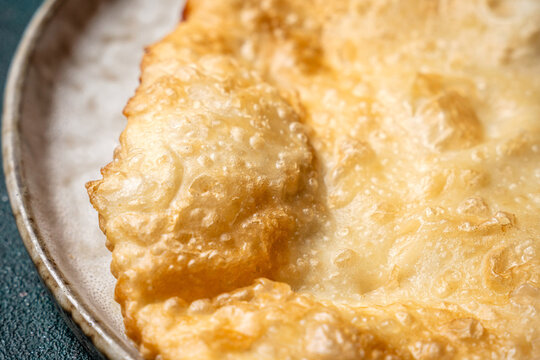 Crispy golden tatar cheburek close up