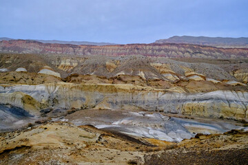 Madygen Geopark Kyrgyzstan Colorful Odd-Even mountains Batken Unique Triassic paleontological site alien landscapes rare fossils.