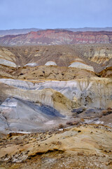 Madygen Geopark Kyrgyzstan Colorful Odd-Even mountains Batken Unique Triassic paleontological site alien landscapes rare fossils.