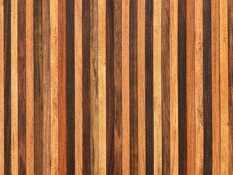 Brown wood fluted panel or fluted strips, rustic wood, seamless background texture.