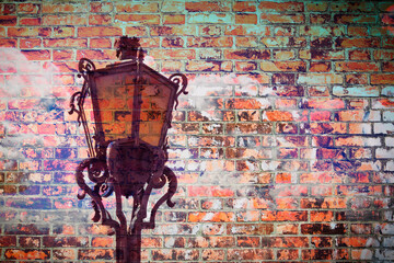 Classic portuguese streetlight - concept image against a a brick wall - image with copy space