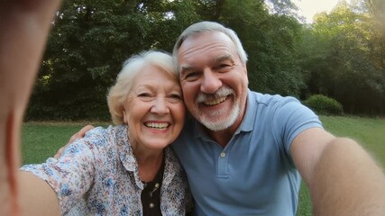 Happy senior couple taking a selfie outdoors - Powered by Adobe