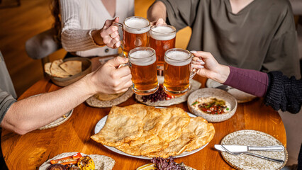 Friends enjoying tatar halal feast with beer