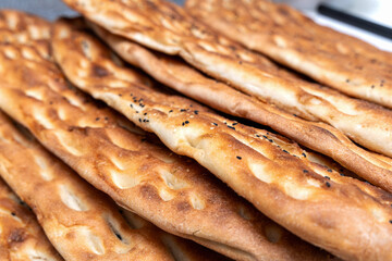 Traditional middle eastern flatbread laid out in row.