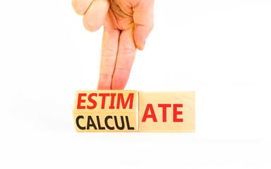 Estimate or calculate symbol. Concept words Calculate to Estimate on beautiful wooden cubes. Beautiful white background. Businessman's hand. Business, estimate or calculate concept. Copy space.
