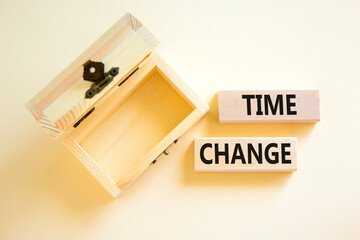 Time change symbol. Concept word Time change on beautiful wooden blocks. Beautiful white paper background. Empty wooden beautiful chest. Business time change concept. Copy space.
