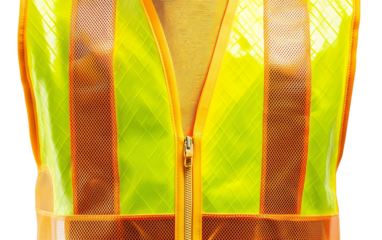 Close up of a bright yellow safety reflective vest highlighting its texture and details