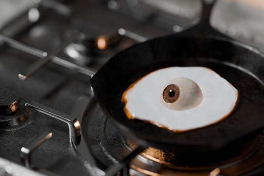 Detailed closeup of eyeball frying like egg in 3D concept