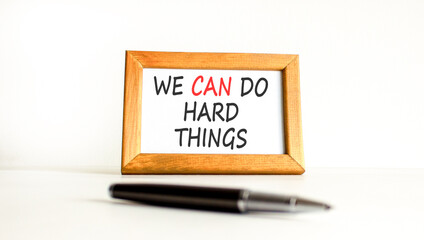 Support, help we can do hard things symbol. Concept words We can do hard things on beautiful wooden picture frame. Beautiful white background. Business we can do hard things concept. Copy space.