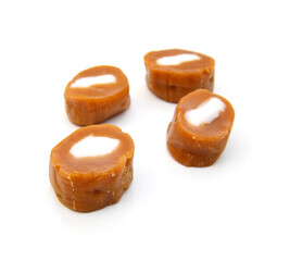 Caramel candies isolated on white background