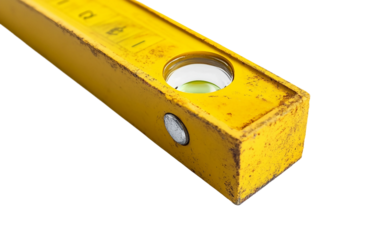 Close up detailed view of a yellow construction spirit level highlighting precise bubble alignment for accurate measurements