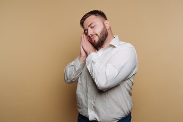 Fototapeta premium Man Pretending to Sleep with Hands Under Cheek