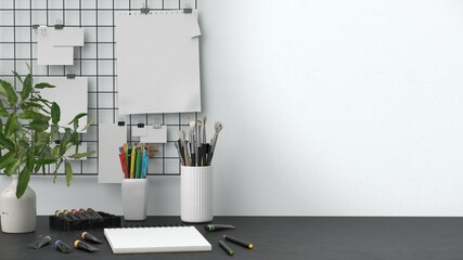 Creative Workspace with Art Supplies and Sketchbooks © Uladyka