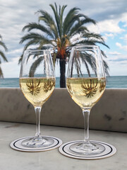 Two glasses of prosecco on terrace overlooking Promenade des Anglais