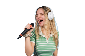 Young woman singing karaoke wearing headphones having fun