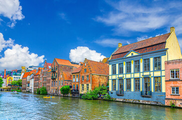 Row of old buildings houses on bank of Lys Leie river in Patershol quarter district in Ghent historical city centre, Gent old town, East Flanders province, Flemish Region, Belgium
