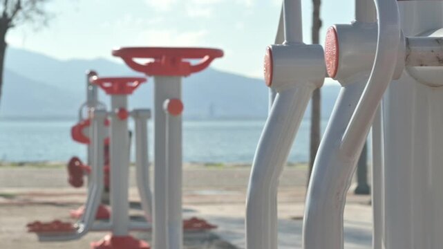The shot highlights an inviting environment that enables wellness, emphasizing the concept of public health and the importance of physical activity. Perfect footage for themes related to seaside fitne