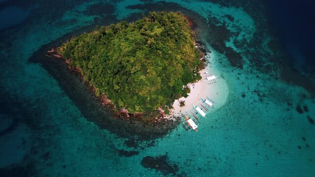 Beautiful tropical island with white sand and beaches surrounded by crystal clear blue water in Palawan, Philippines, South East Asia