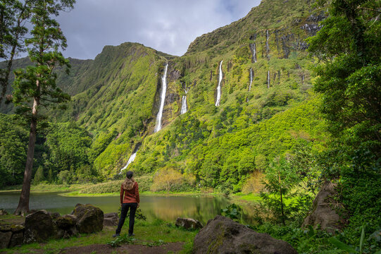 Woman alone on her back, enjoying the Po&ccedil;o da Ribeira do Ferreiro, Po&ccedil;o da Alagoinha, Flores island, Azores.