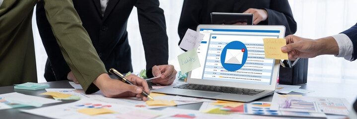 Analyst team use sticky note for creative and analytic brainstorm for business idea with BI data dashboard on laptop screen. Analysis financial data visualization tech for marketing strategy. Prodigy