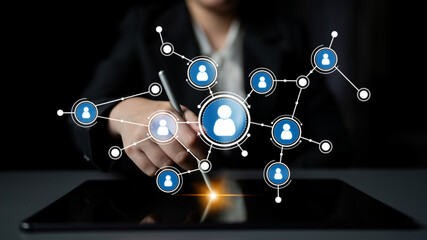 A business professional engages with digital networks on a tablet, showcasing modern communication and collaboration strategies in a professional workspace environment. Tessel