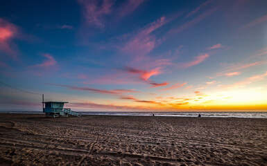 Famous lifeguard tower in Santa Monica beach at sunset