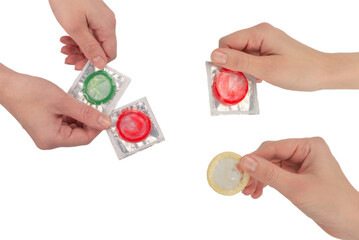 Condom in woman hand isolated on white background.