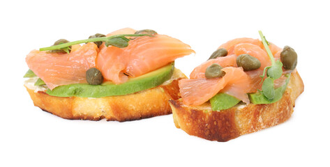 Tasty bruschettas with salmon, avocado, capers and microgreens isolated on white