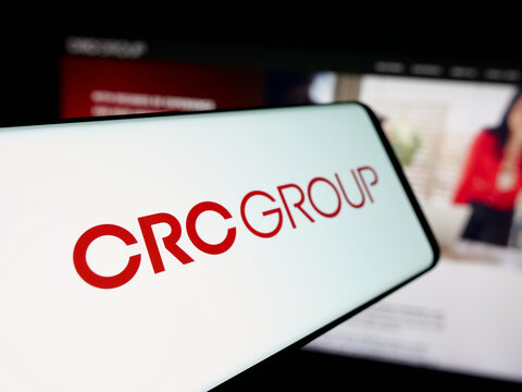 Stuttgart, Germany - 11-28-2025: Smartphone with logo of US company CRC Insurance Services LLC on screen in front of website. Focus on center-left of phone display.