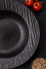 An empty round ceramic plate on a table, kitchenware. An empty plate