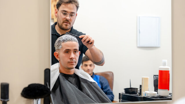 Hair bleaching in a modern barbershop setting