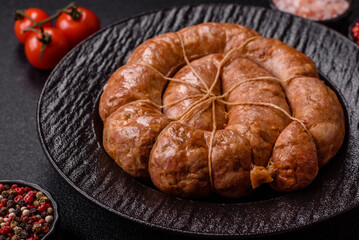 Grilled sausage in the shape of a spiral or snail, from chicken or pork. Spiral or snail sausage