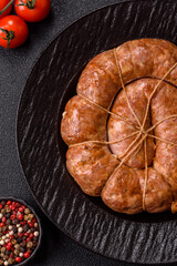 Grilled sausage in the shape of a spiral or snail, from chicken or pork. Spiral or snail sausage