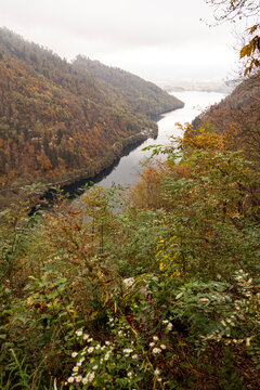 Scenic view of Levico Lake in autumnal forest