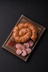 Grilled sausage in the shape of a spiral or snail, from chicken or pork. Spiral or snail sausage