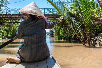 Local Woman Paddling Traditional Canoe Mekong Delta, Vietnam