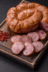 Grilled sausage in the shape of a spiral or snail, from chicken or pork. Spiral or snail sausage