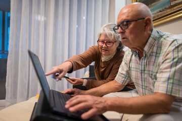 Active seniors embracing digital technology together