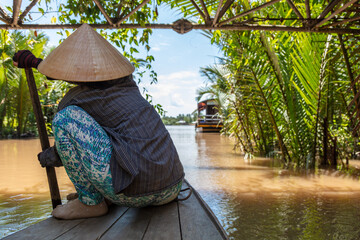 Local Woman Paddling Traditional Canoe Mekong Delta, Vietnam