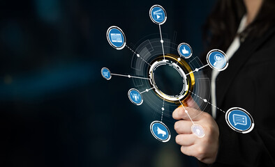 A businesswoman holds a magnifying glass amidst digital icons, symbolizing research and innovation. The image captures the essence of modern technology and strategic analysis. Crux