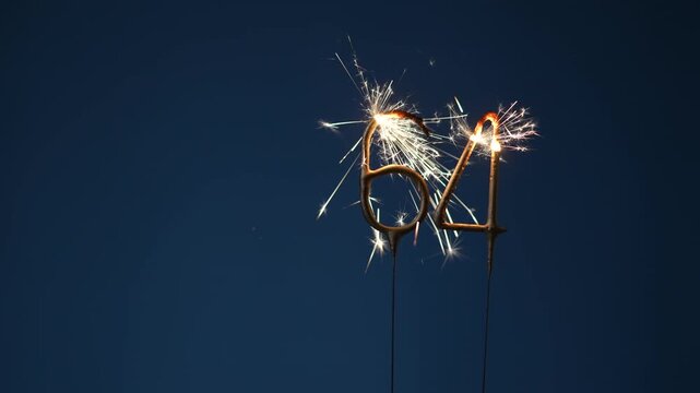 64 years celebration festive background made with Bengal fires in the form of number Sixty four.