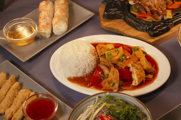 Asian cuisine dish served on a plate with gray background, reflecting traditional food culture